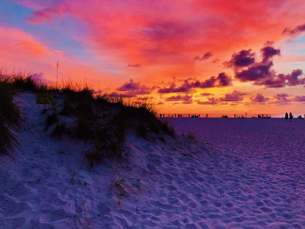 Photo of the spectacular Clearwater Beach Sunsets with the brilliant colors of red, orange, and yellow skies.
