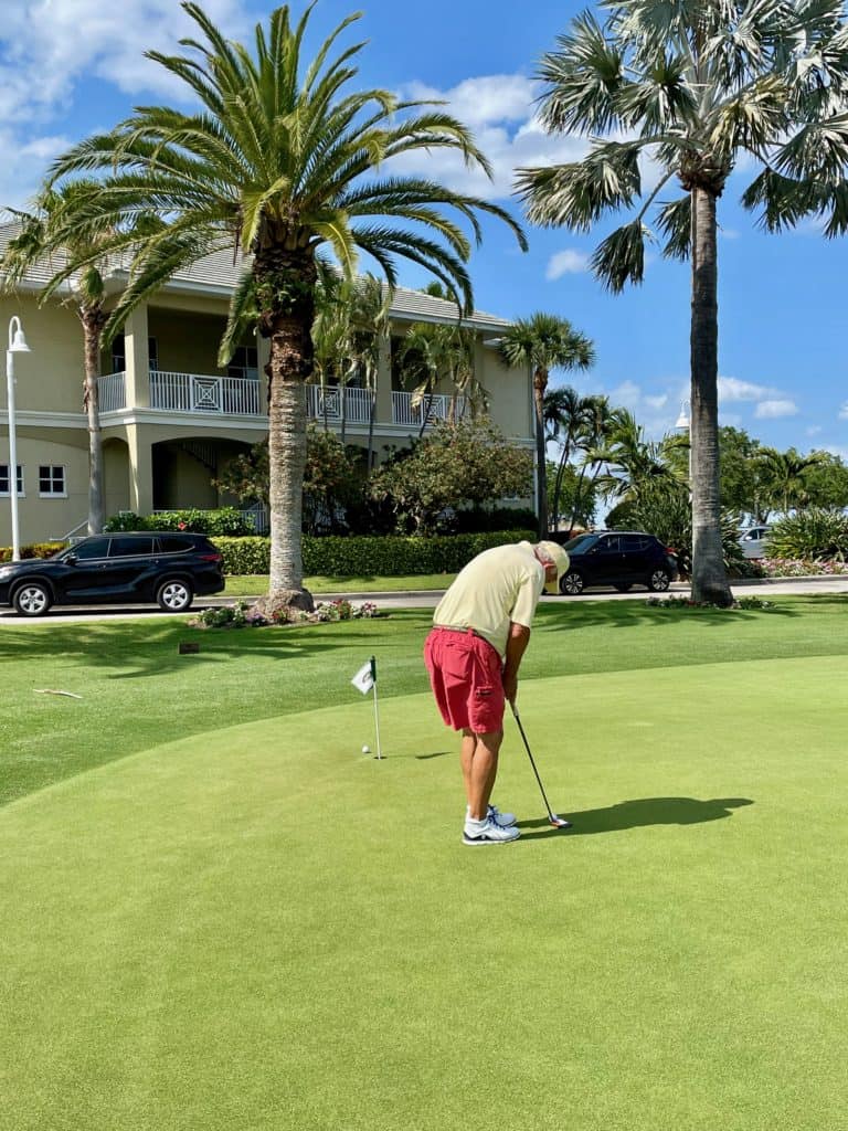 Pinellas County Golf Courses - Isla Del Sol Country Club - golfer putting on the green in St Petersburg FL 