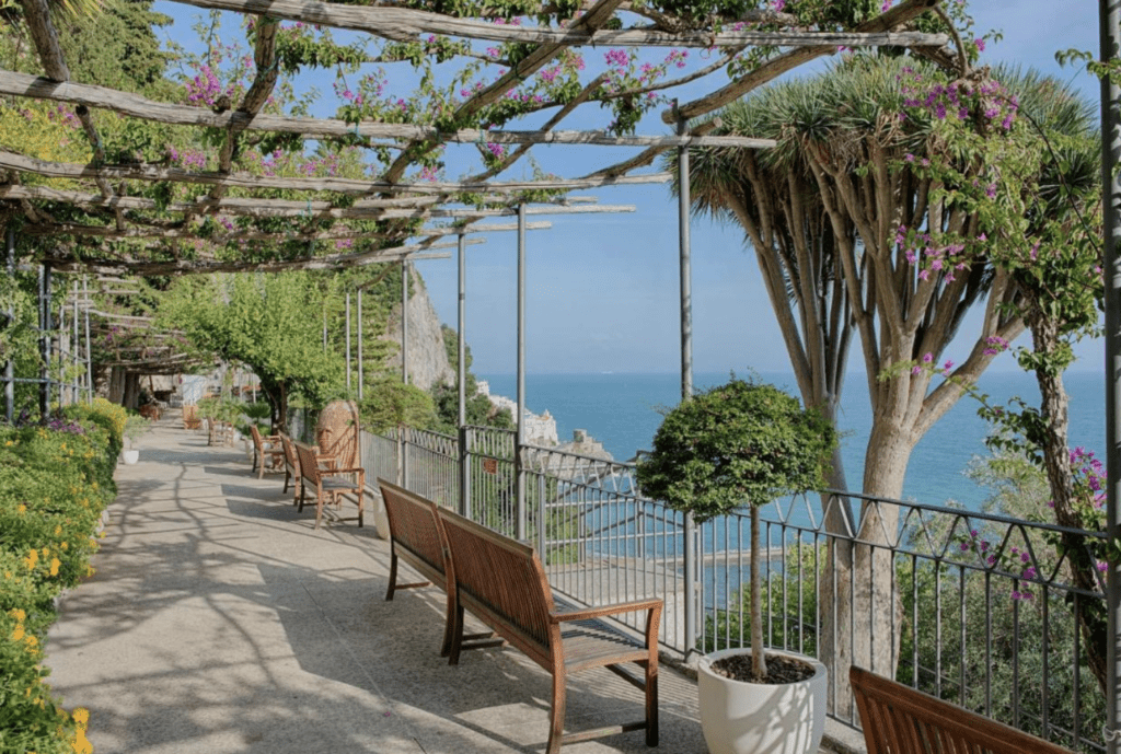 Boutique Hotels Amalfi Coast NH Collection Grand Hotel outdoor view overlooking the sea.  Sit on this bench and enjoy the breeze.
