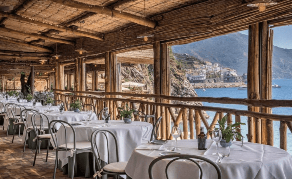 Boutique Hotels Amalfi Coast Hotel Caterina dining photo with white table cloths and sea views.