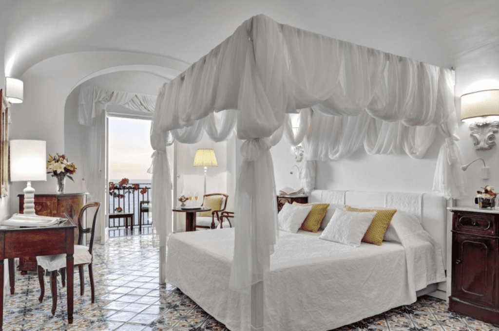  Boutique Hotels Amalfi Coast has beautiful tile floors and white linens at Hotel Caterina. 