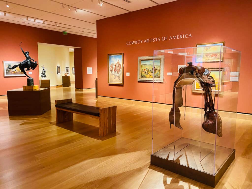 Photo of the western art at  The James Museum. Look at the saddle and the beautiful paintings.  Best Museums in St. Petersburg Florida