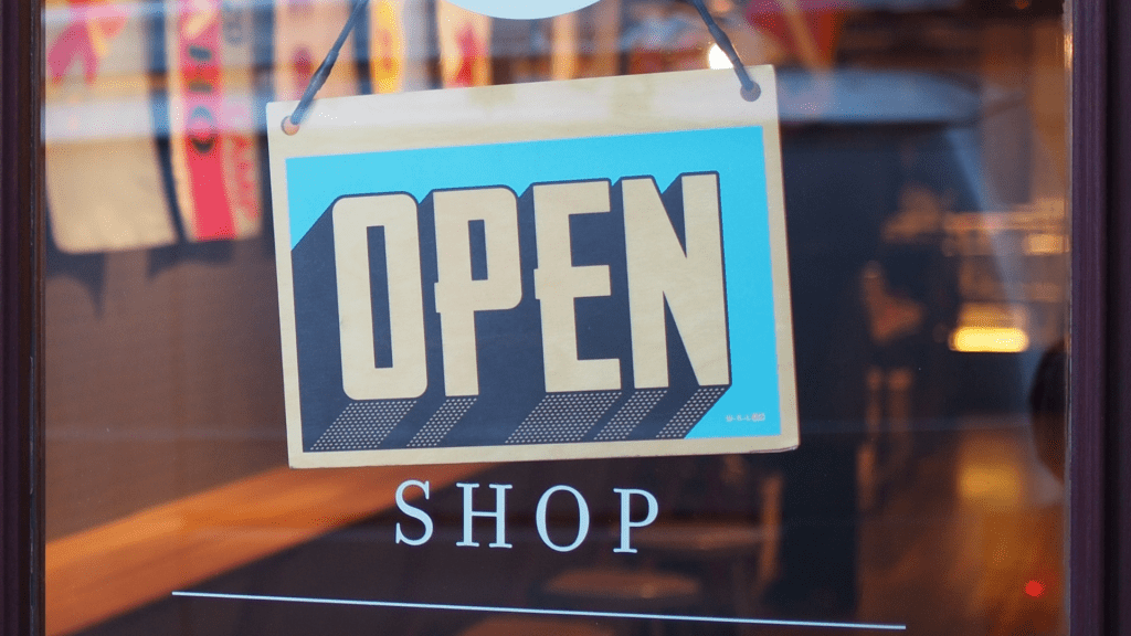Shop sign showing open for visitors.  