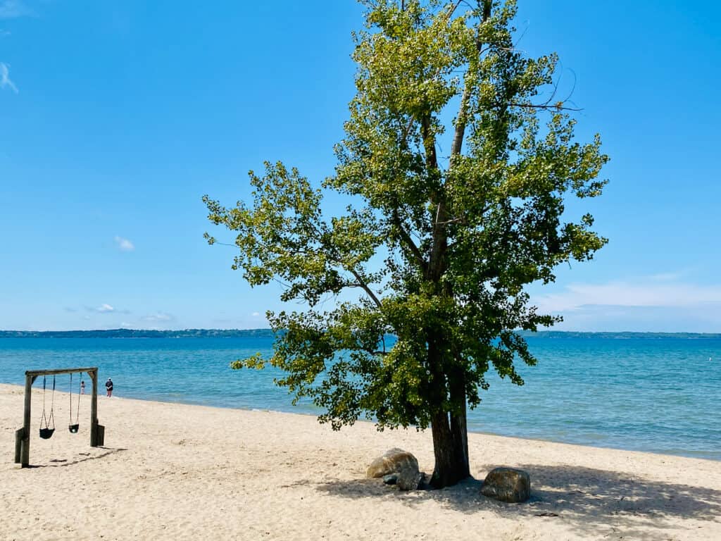 Elk Rapids beach view with gorgeous blue green Traverse bay water views.