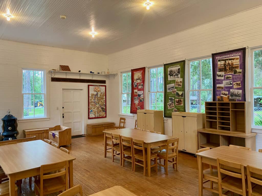 This one room school house shows seats, chalk board, and what a old school house would look like from a replica, circa 1912.