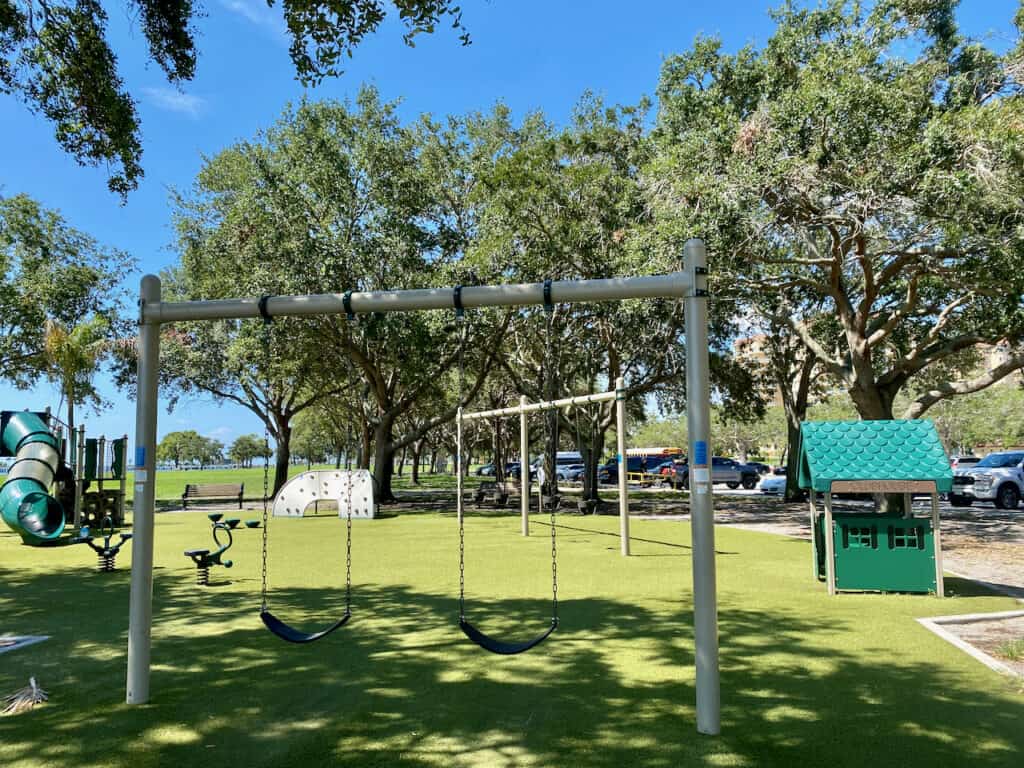 North Shore Park Kids Playground year round and features slides, swings, and clubhouse.