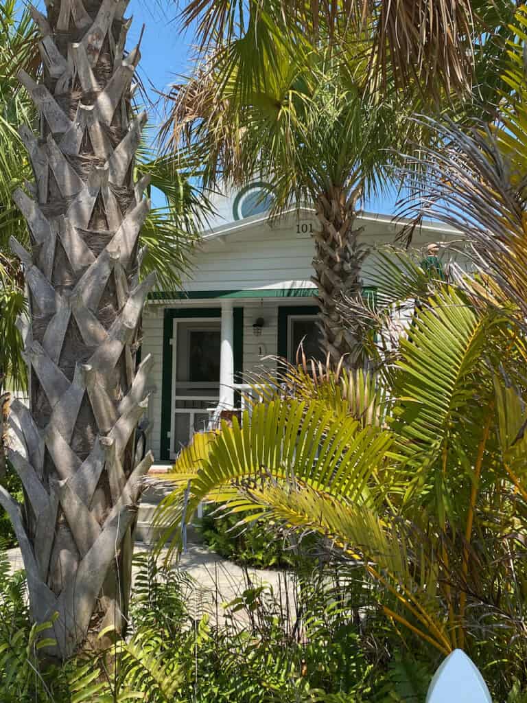 Photo of Zephaniah Phillips Homestead in Pass-a-Grille. It is a small white house with green trim in the heart of downtown.