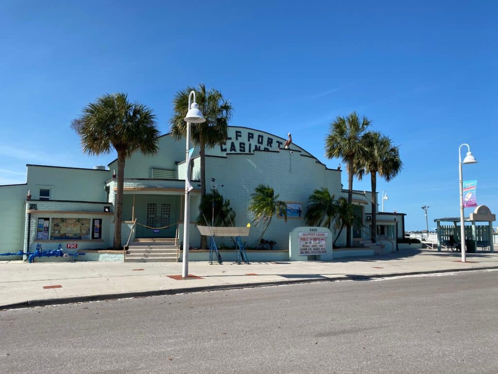 Photo of the pale green-colored Gulfport Casino - historic waterfront building - an ideal location for a Tampa Bay Farmers Market.