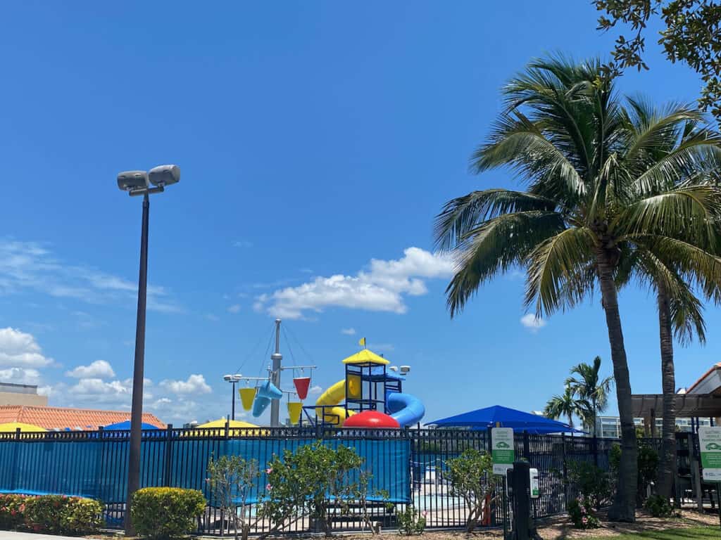 Colonel Michael J. Horan Park photo of the waterpark and palm trees. 