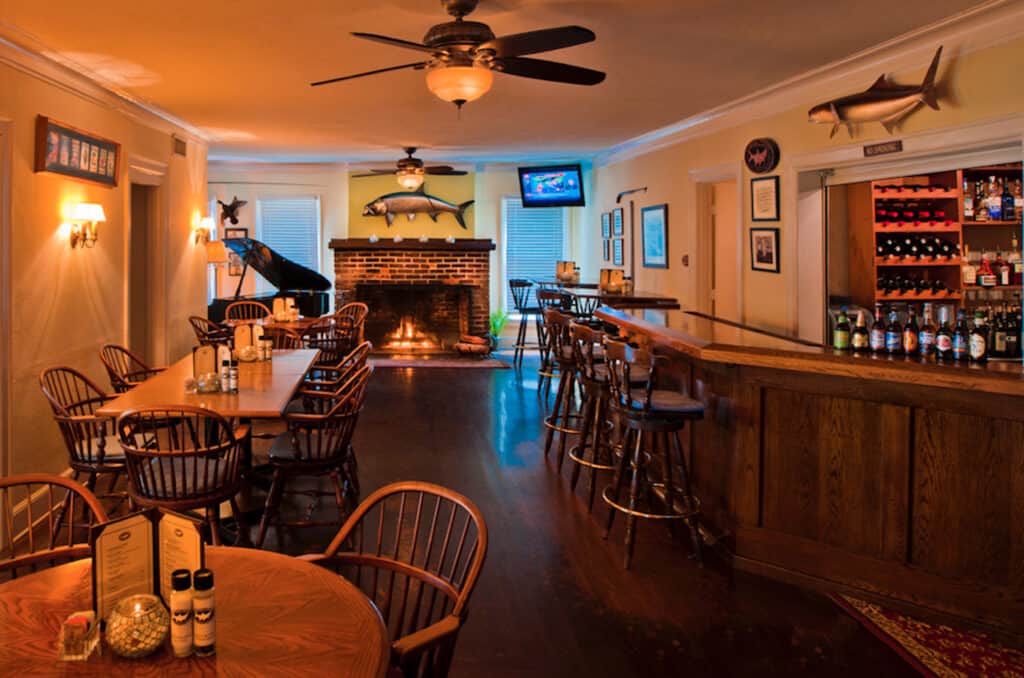 Photo Credit: Tarpon Lodge Restaurant in Pine Island interior photo of cozy bar and lounge.