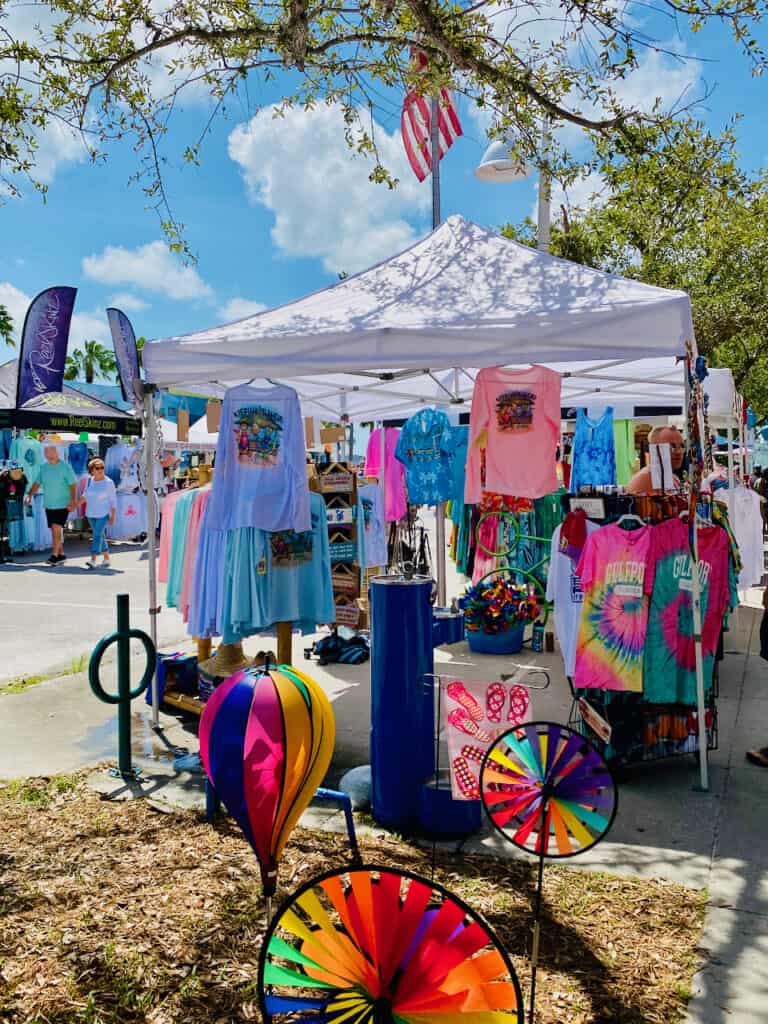 Gulfport Geckofest t-shirt booth selling items as well as Gulfport Shops