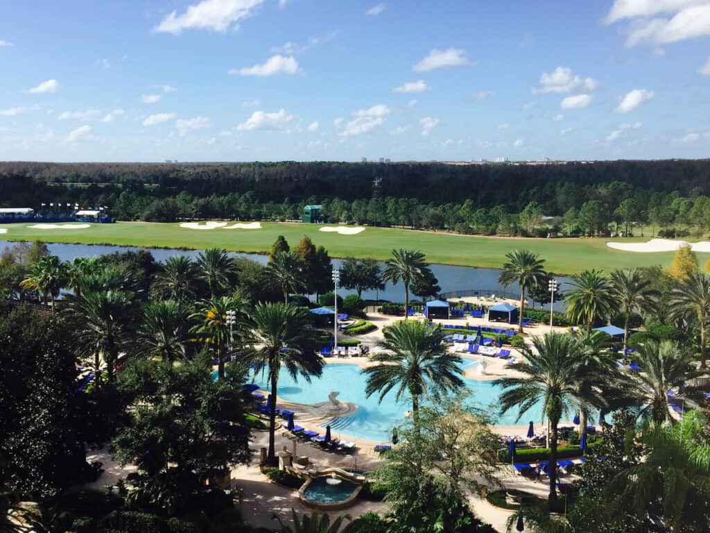 Tampa vs Orlando for Families  - when deciding Orlando has some amazing resorts for the family.  This is a photo of the Ritz Carlton Orlando with views of the pool and the golf course behind it. 