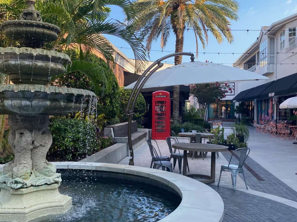 Hyde Park Village Shops in Tampa, FL - fountain and red phone booth gives a charming European feel.  