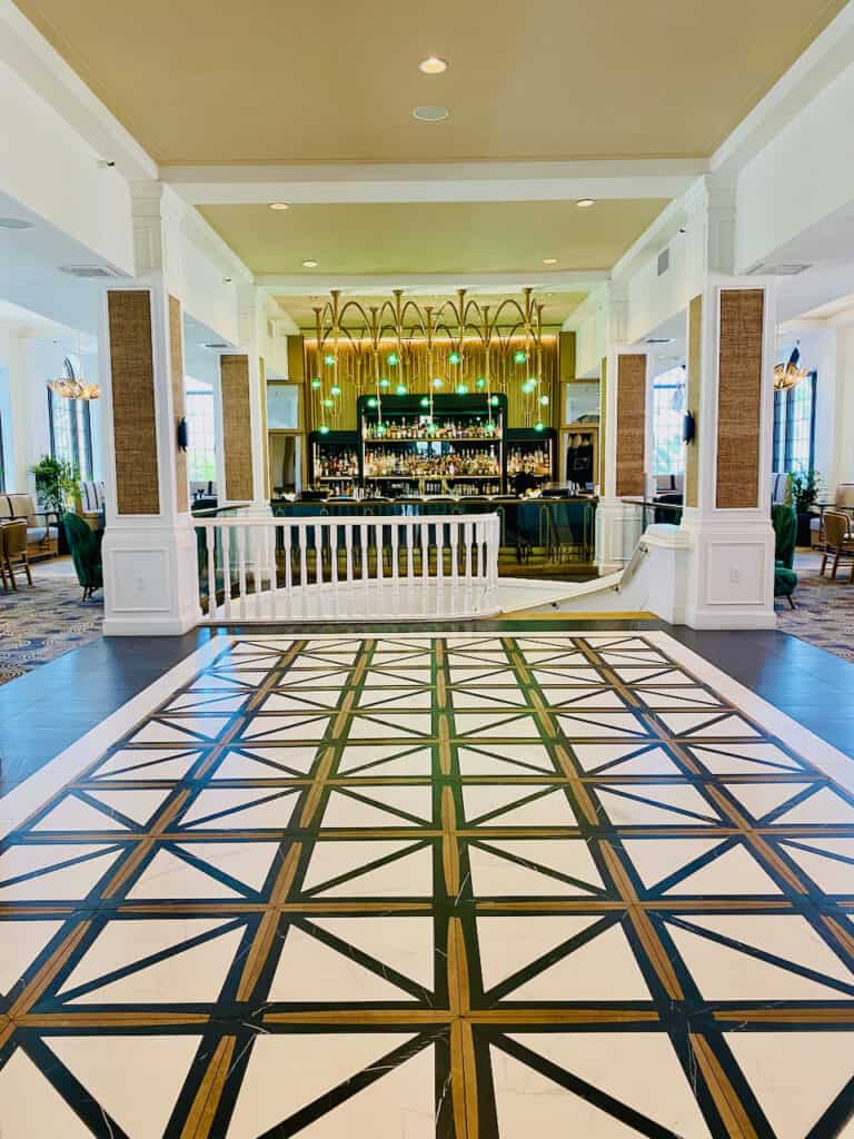 Hotel lobby is large with beautiful tile flores with gold, back, and white. It has a green colored bar also off the lobby. Don CeSar is a great place for a St. Pete Spring Break Hotel.