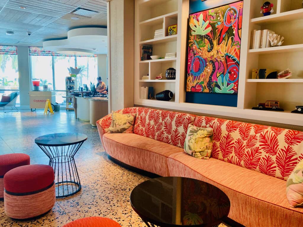 Interior of the Bellwether resort with comfy bright coral color couches.