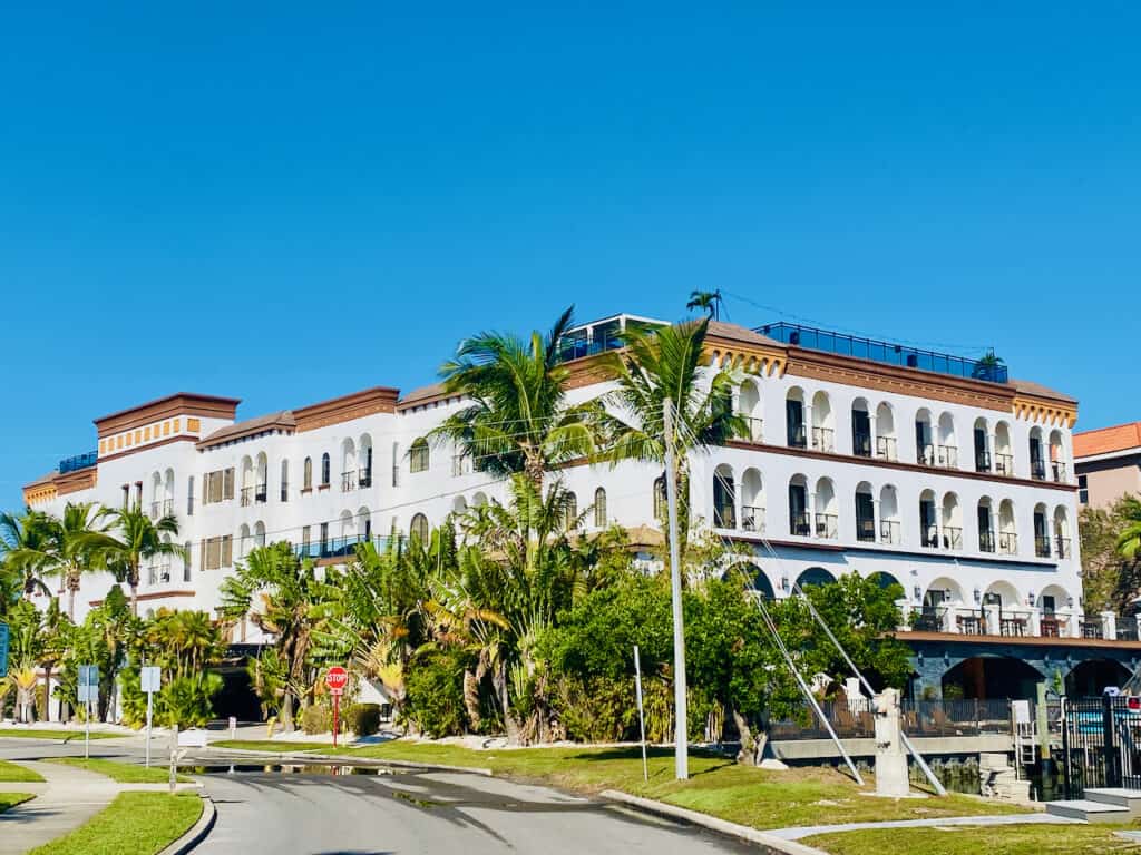 The Hotel Zamora Exterior with a boat dock out back.  It is one of the few hotels in St Pete Beach with dock and dine access. 