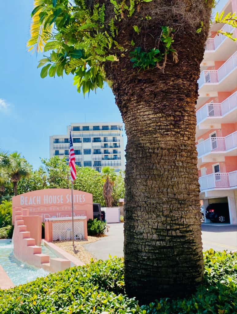 Front entrance into the Beach House Suites has a large palm tree and waterfall by the sign. This St Pete Beach Hotel stands proudly in pink with balcony rooms overlooking Gulf Blvd.