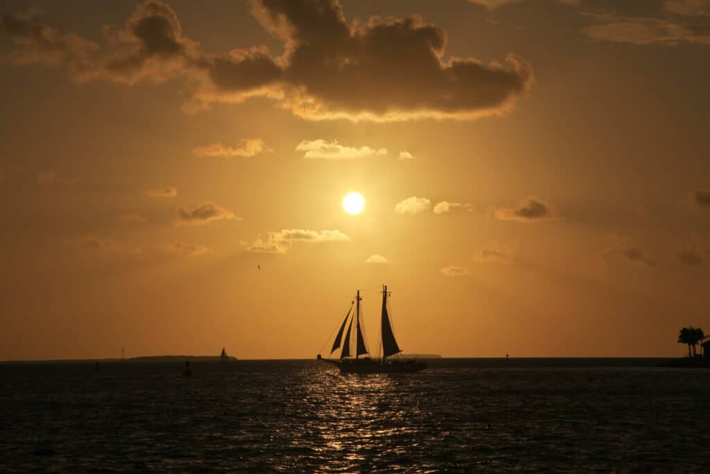Sailing at sunset, sunset tours with a sailboat. 