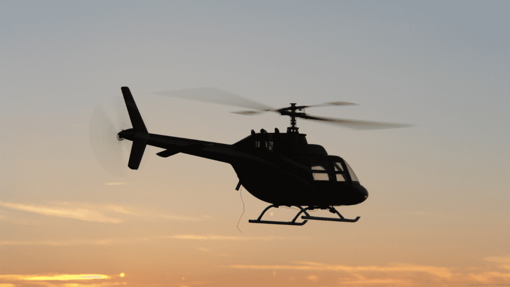 St Pete Helicopter Tours - photo taken of the helicopter flying at sunset. 