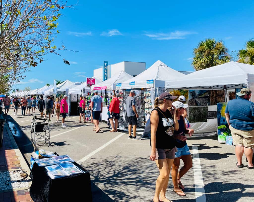 Corey Avenue Sunday Market photo with shops and people walking by.  corey avenue sunday market parking is located on the next streets over.