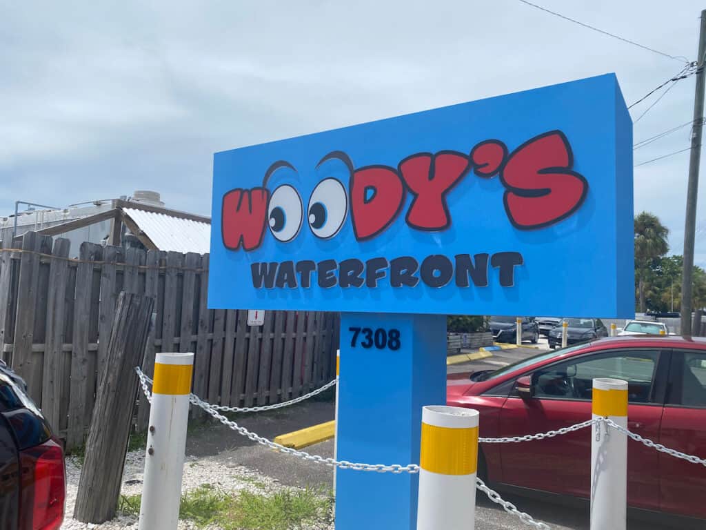 Woody's Waterfront St Pete Beach blue sign. 