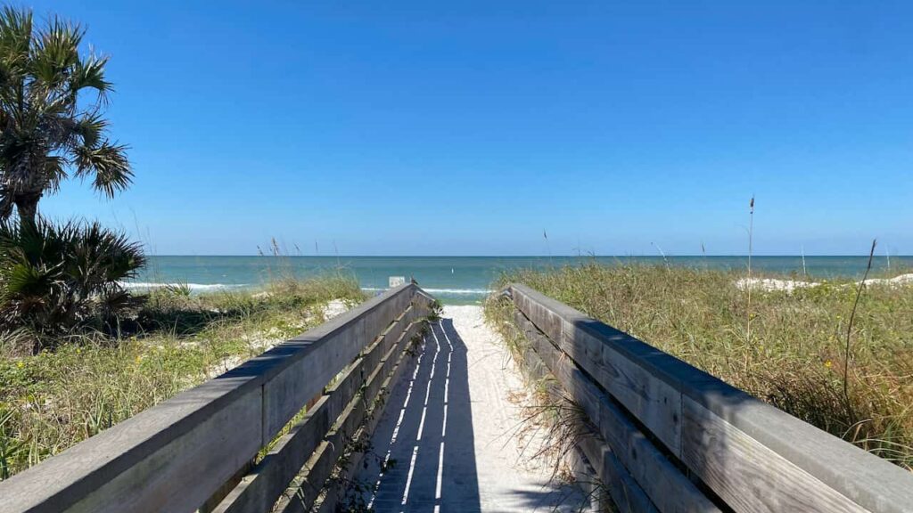 Beach walkway at Indian Rocks Beach. Hotels in Indian Rocks Beach are located within steps of beauitful white sugar sand and blue green water.