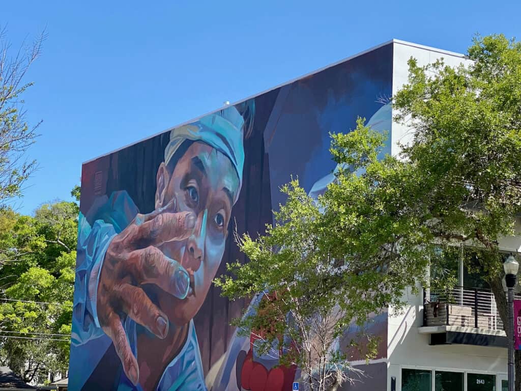 St Pete Mural with hand reaching out