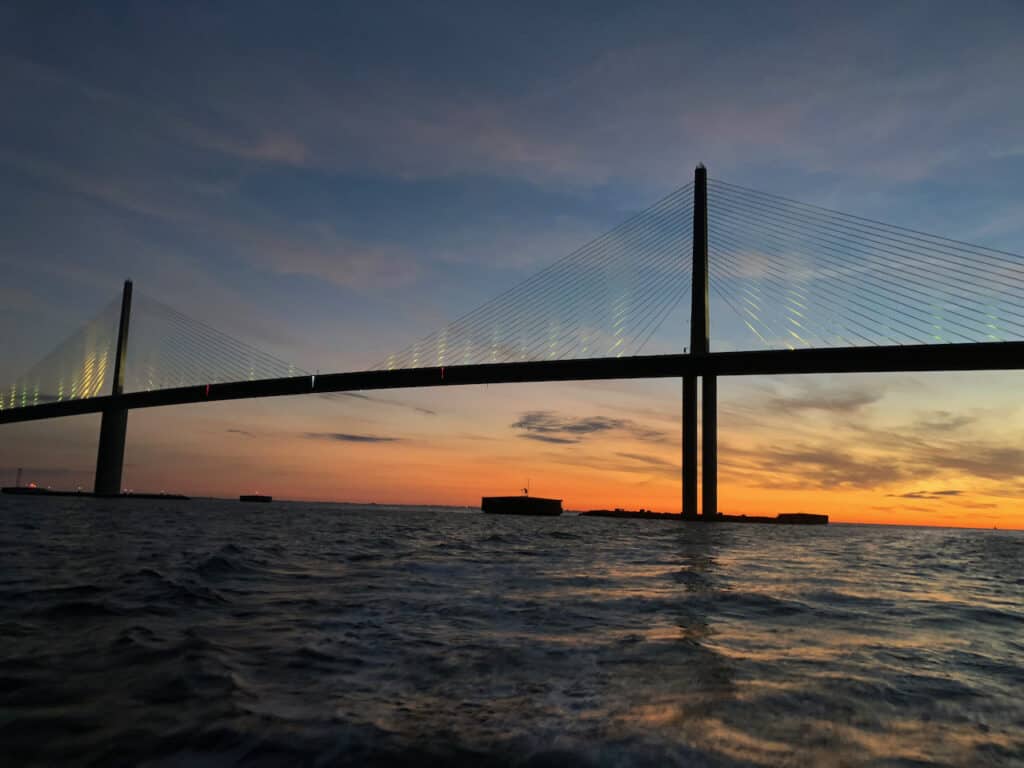 Sunset photo was taken on the water of the Sunshine Skyway Bridge