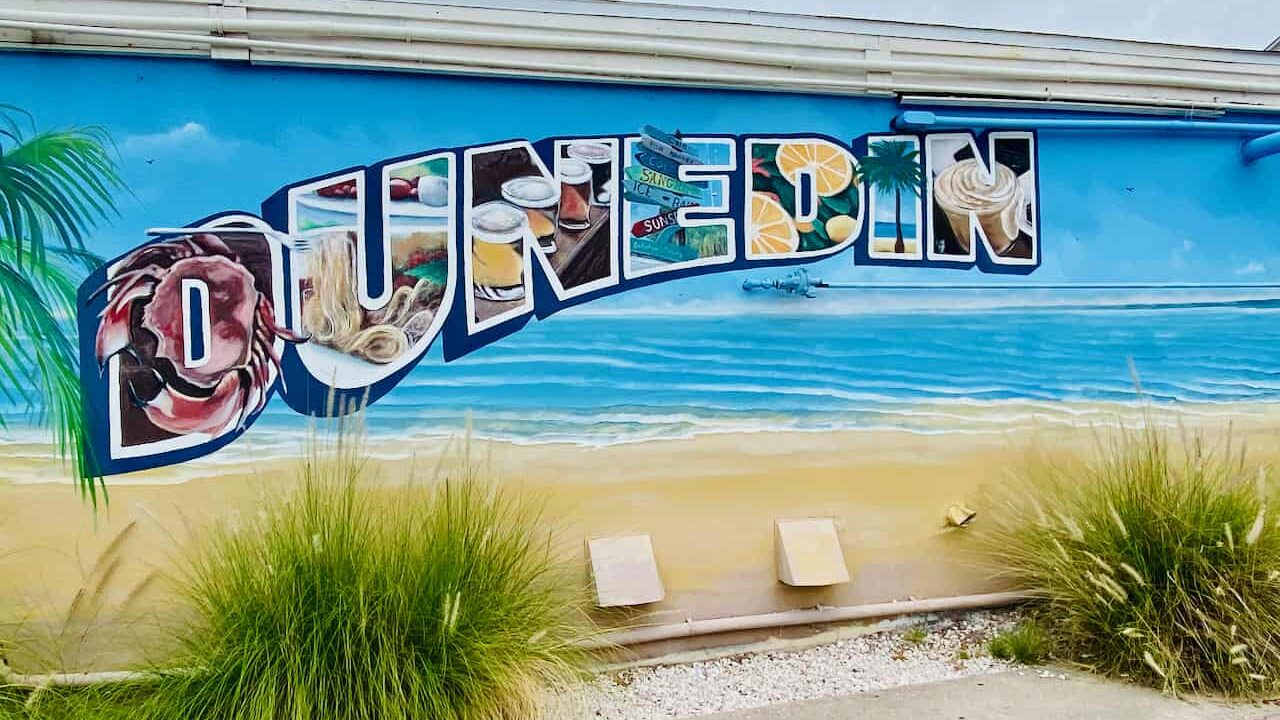 best things to do in dunedin fl article - photo of the dunedin sign near the dunedin marina