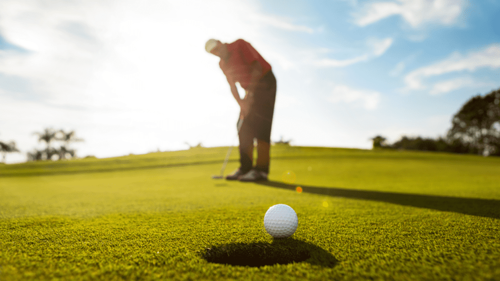 golfer putting on the green