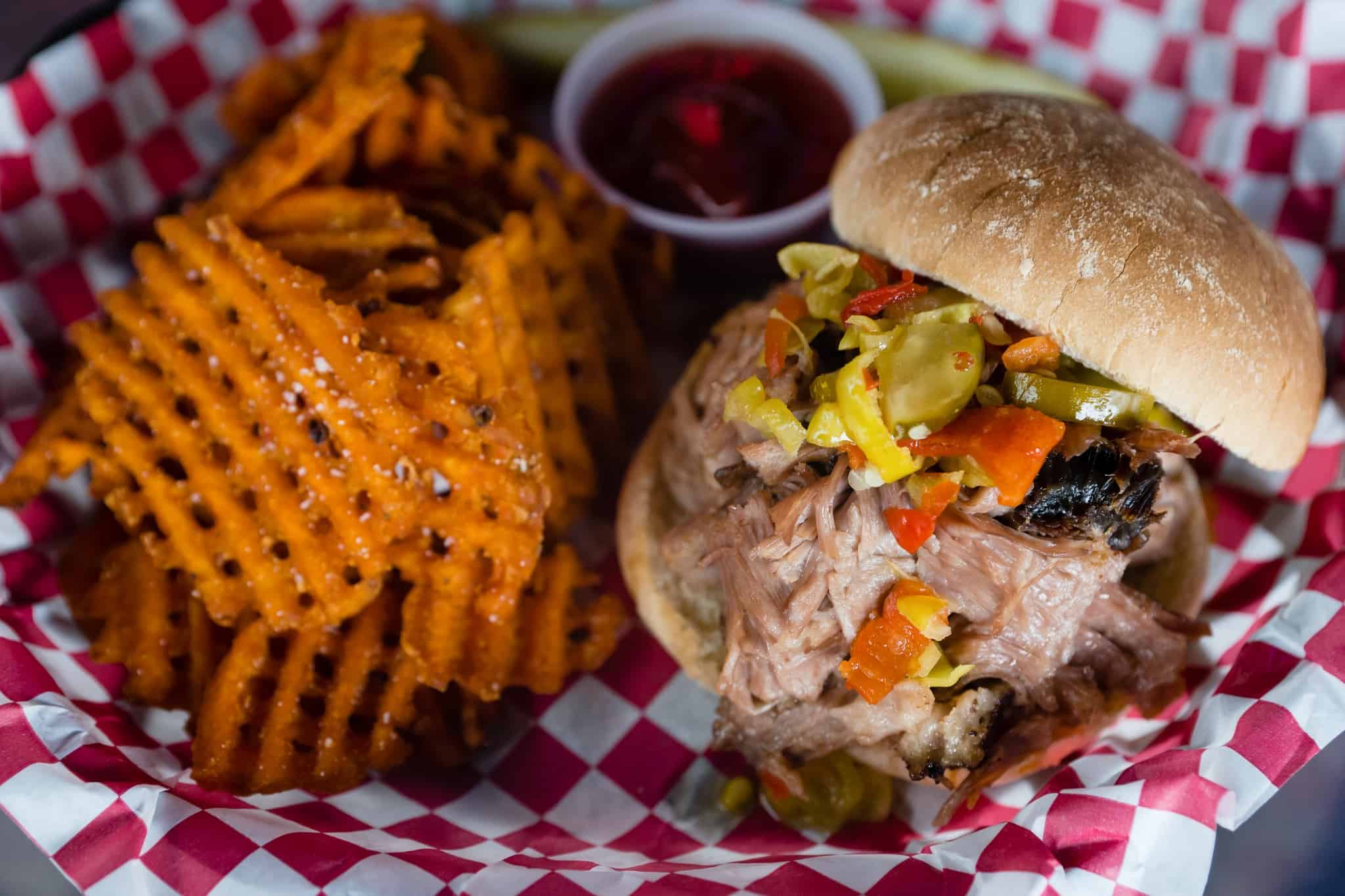 Dunedin Smokehouse pulled pork and waffle fries that will melt in your mouth.