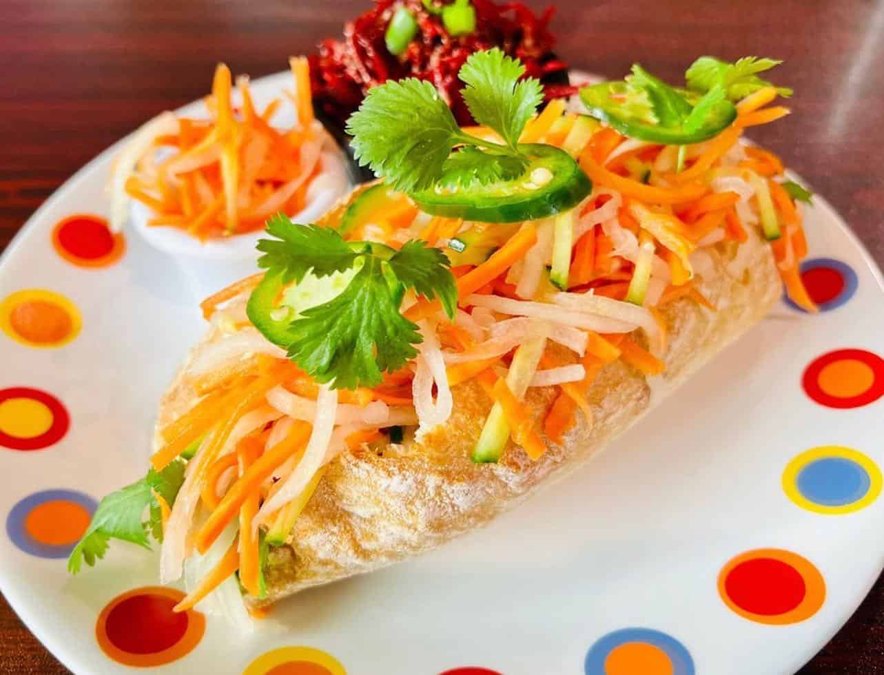 Ohana Cafe decorative plate of healthy food with bright colors.