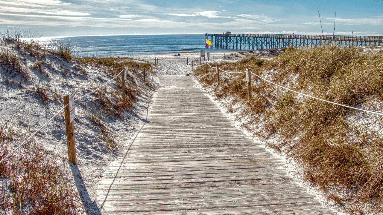 St. Andrews State Park view of the boardwalk and Gulf of Mexico sparkling in the distance.