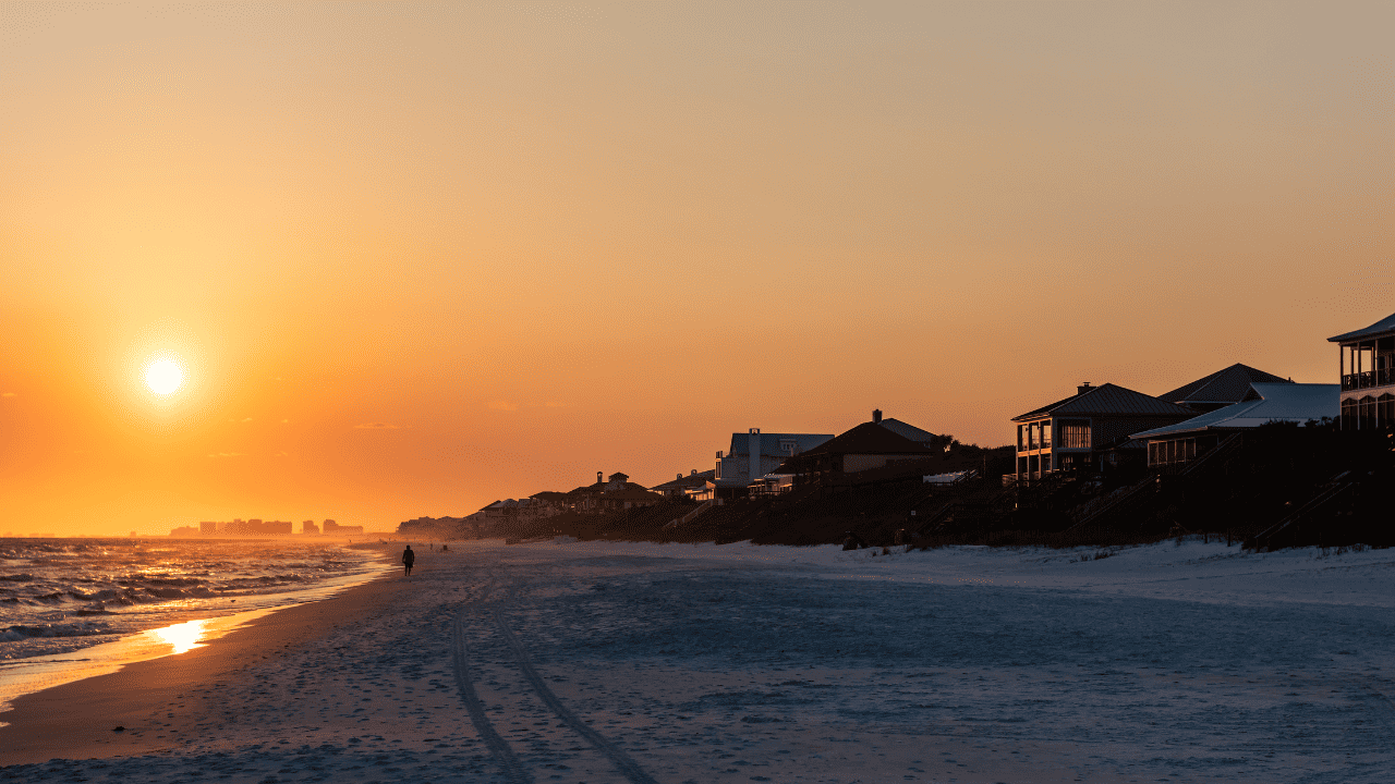 Santa Rosa Beach sunset with houses in the distance.