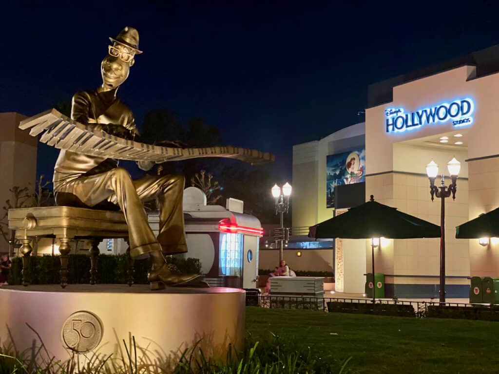 Photo of Hollywood Studios sign next to the brown derby taken at night.