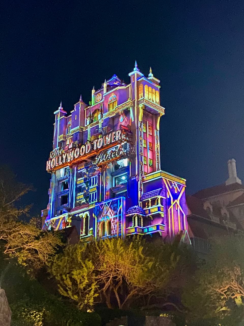 Hollywood Tower of Terror at night lit up with lights