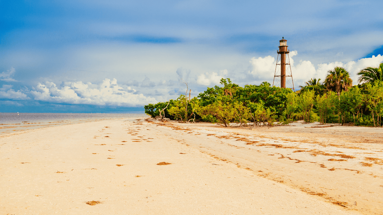 Sanibel Island with lighthouse in the distance and beautiful sand