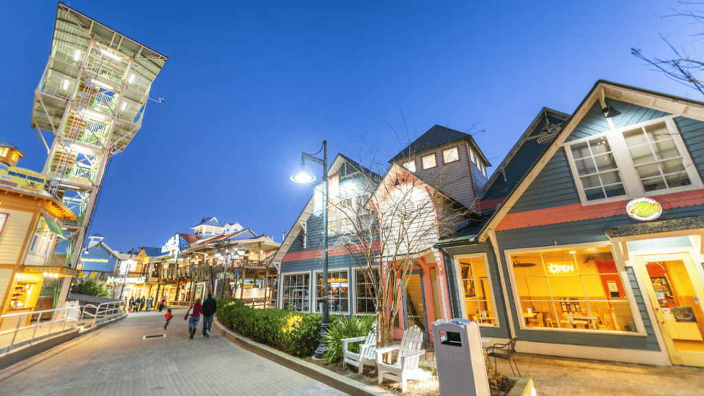 photo of destin harborwalk at night - article on panama city beach or destin