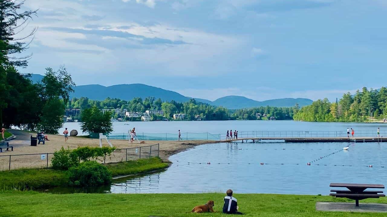 things to do in Lake Placid NY,  swimming area showing kids going to teh water 