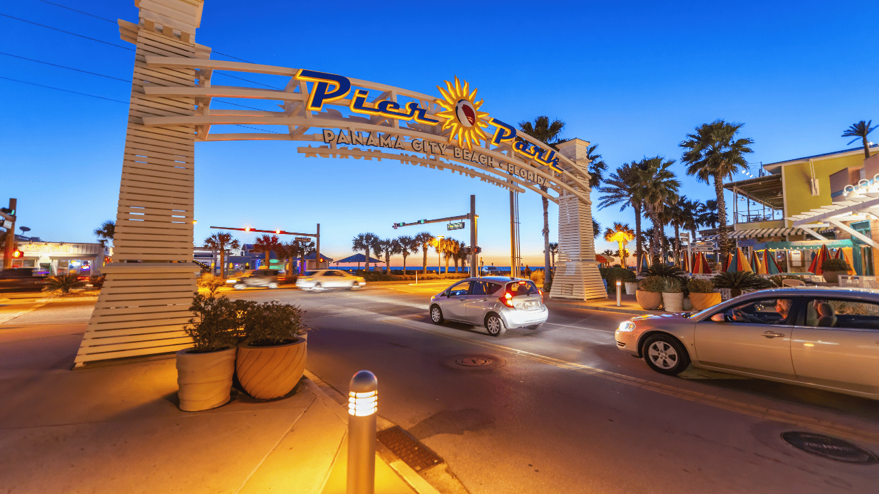 Pier Park entrance sign at sunset