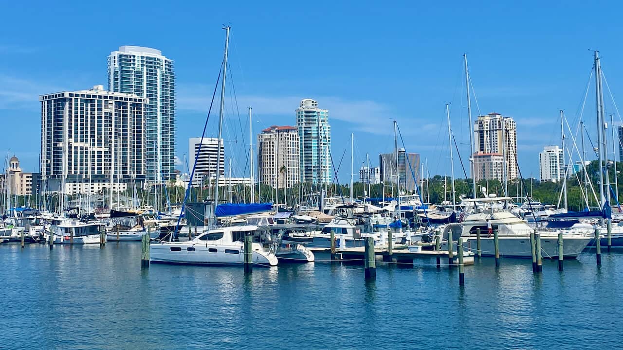 downtown St Petersburg waterfront view of boats and buildings in the distance.