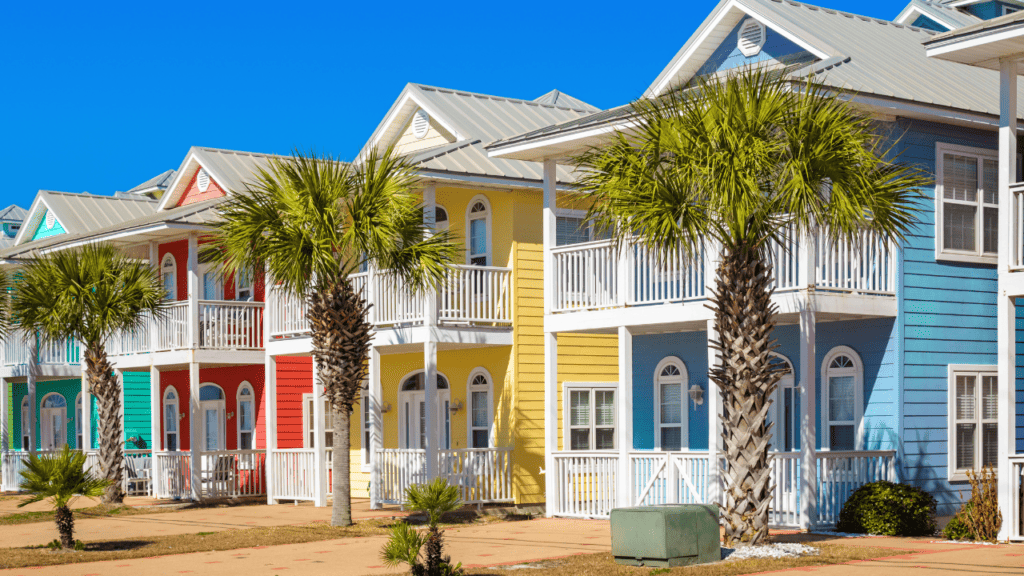 Panama City Beach houses in colorful beach colors with bright yellow, blue, coral, and teal.