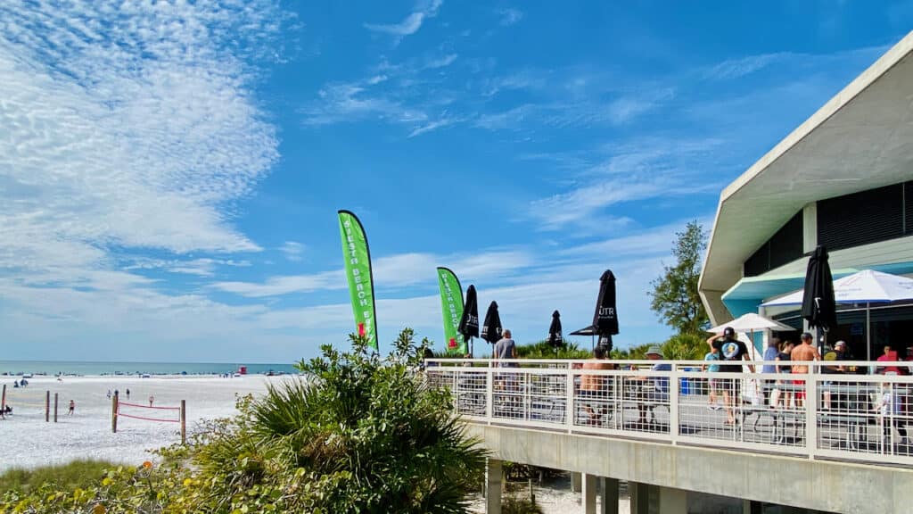 siesta key beach is one of the best beaches in Florida like Clearwater Beach.  Showing beach volleyball and concession area.