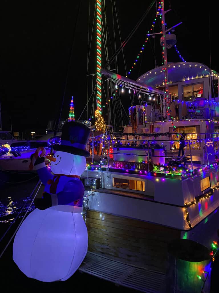 St Petersburg Boat Parade 2022 showing a snowman and boat on the water.