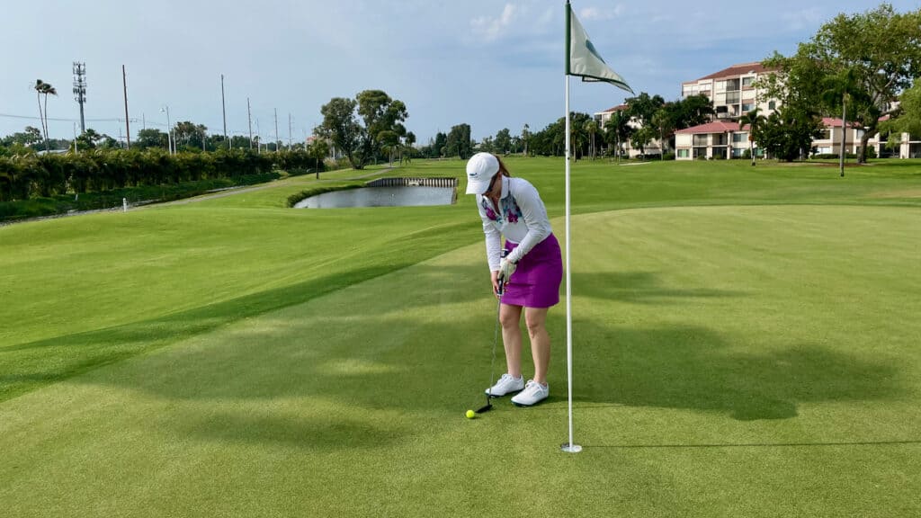 Erin playing golf in Florida