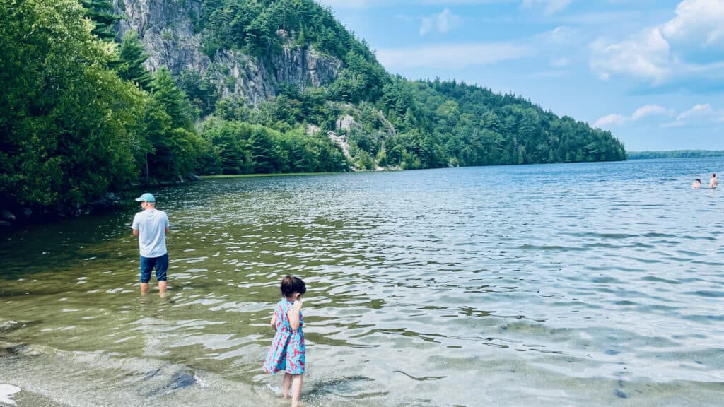 Echo Lake Beach taken with swimmers in the pond, Colleen showing her family enjoying swimming in Echo Lake Beach