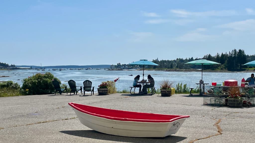  Archie's Lobster in Bass Harbor showing a boat with water views as diners eat